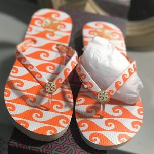 Tory Burch orange wave flip flops